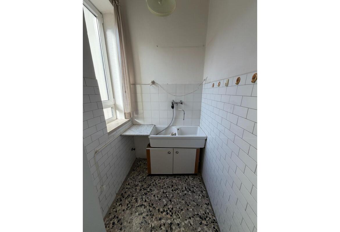 APPARTAMENTO TRILOCALE CON GRAZIOSA TAVERNA E CORTILETTO